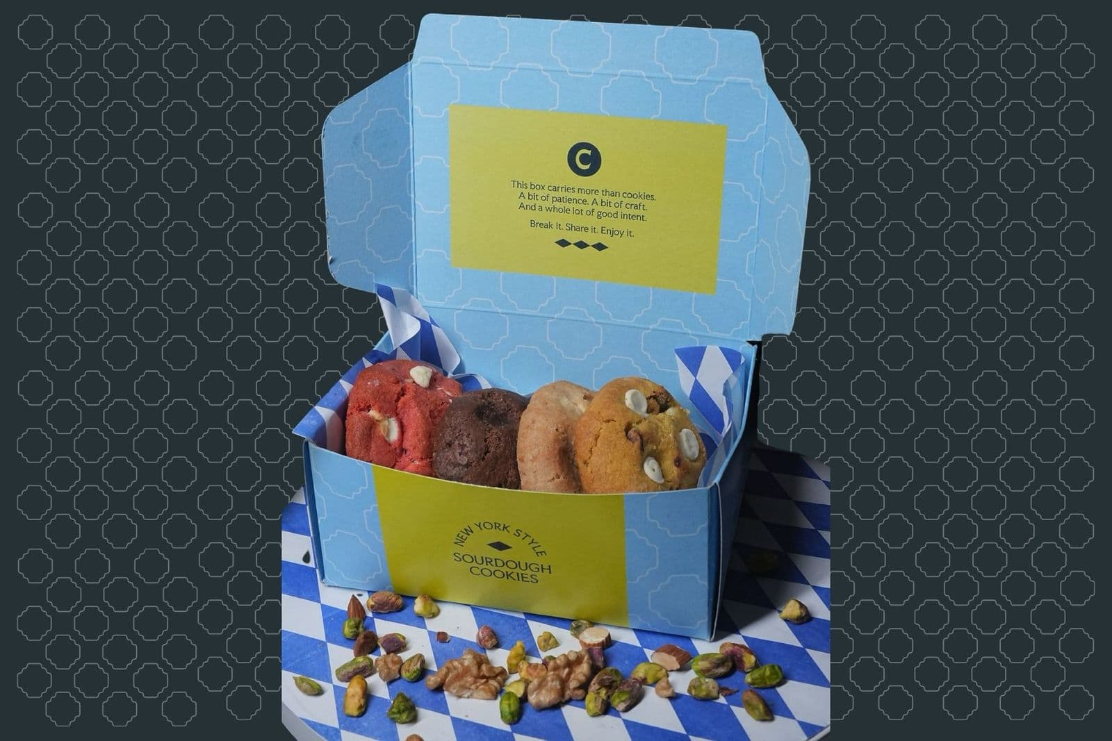 An open Cultured Cookie Co. box with a mixed selection of cookies